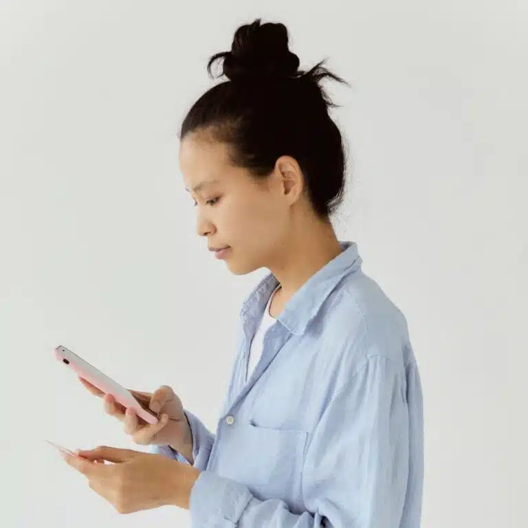woman checking credit on phone