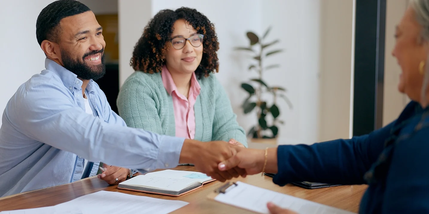Couple having a meeting. Shaking hands